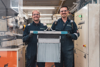 Ben Houlton and Sam ONeill hold up first plate of zinc from pilot plant